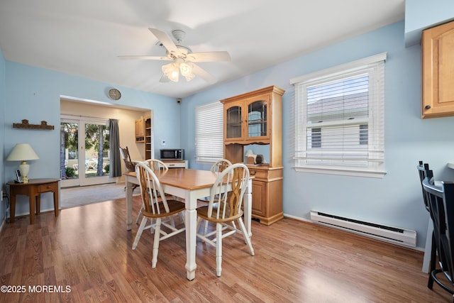 188 Lions Head Blvd S, Brick, NJ 08723 - dining area featuring a baseboard radiator, light wood-style floors, and ceiling fan