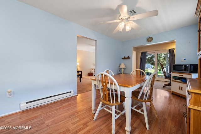 188 Lions Head Blvd S, Brick, NJ 08723 - dining area featuring baseboard heating, light wood-style floors, and ceiling fan