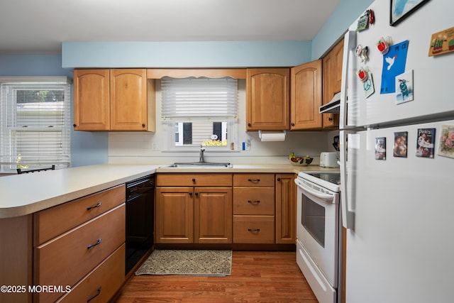 188 Lions Head Blvd S, Brick, NJ 08723 - kitchen with white appliances, wood finished floors, light countertops, and a peninsula