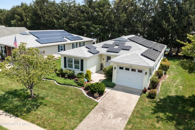 188 Lions Head Blvd S, Brick, NJ 08723 - view of front facade with a front lawn, a garage, driveway, solar panels, and a shingled roof