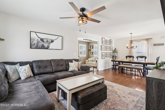 98 Washington St, Keyport, NJ 07735 - living room featuring wood finished floors, ceiling fan, and a chandelier