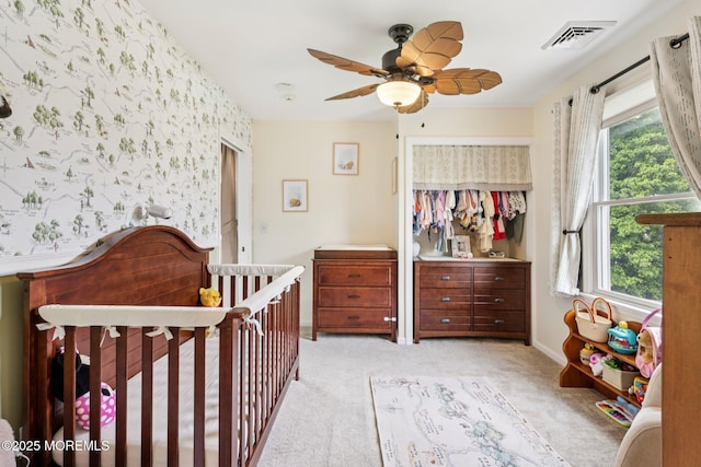 98 Washington St, Keyport, NJ 07735 - bedroom featuring multiple windows, light carpet, a closet, wallpapered walls, and ceiling fan