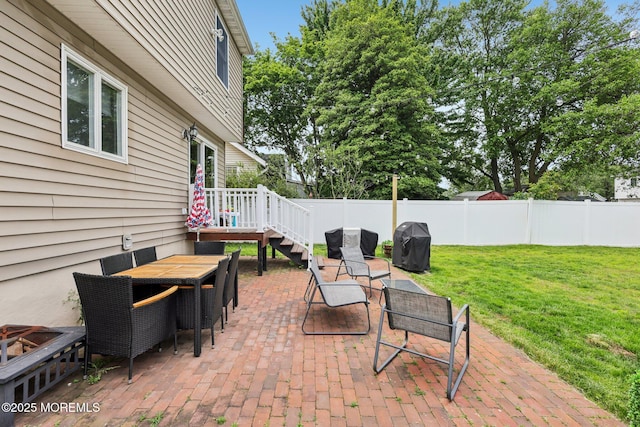 98 Washington St, Keyport, NJ 07735 - fenced backyard with area for grilling, a patio, and outdoor dining space