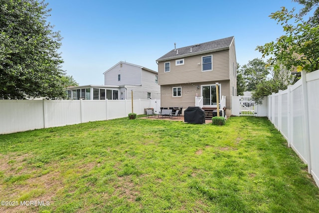 98 Washington St, Keyport, NJ 07735 - back of house featuring a fenced backyard, a patio, a gate, and a sunroom