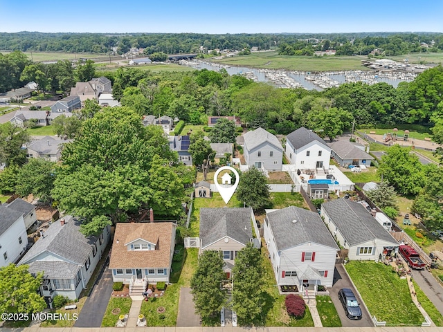 98 Washington St, Keyport, NJ 07735 - aerial perspective of suburban area featuring a nearby body of water and a tree filled landscape