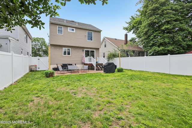 98 Washington St, Keyport, NJ 07735 - back of property featuring a gate, a fenced backyard, and a patio