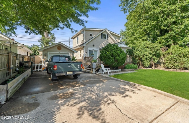517 Laurel Ave, West Allenhurst, NJ 07711 - view of front of house featuring a detached garage, an outdoor structure, and driveway