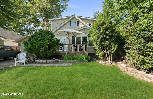 517 Laurel Ave, West Allenhurst, NJ 07711 - view of front facade featuring a wooden deck and a front lawn