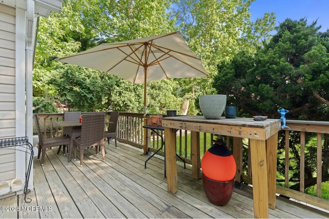 517 Laurel Ave, West Allenhurst, NJ 07711 - wooden deck featuring outdoor dining space and view of wooded area