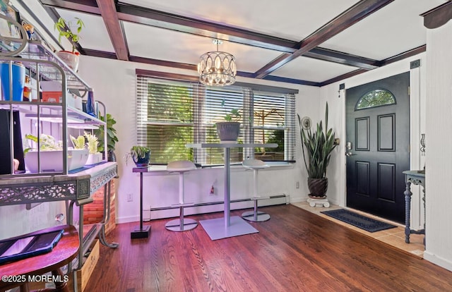 517 Laurel Ave, West Allenhurst, NJ 07711 - foyer entrance featuring coffered ceiling, plenty of natural light, a baseboard heating unit, a chandelier, and wood finished floors