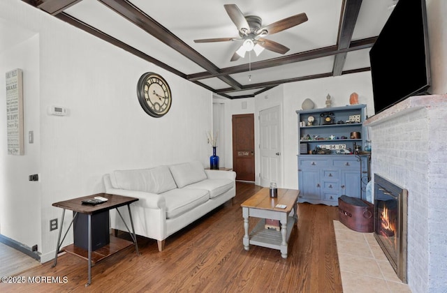 517 Laurel Ave, West Allenhurst, NJ 07711 - living area with coffered ceiling, a ceiling fan, light wood-style floors, a fireplace with flush hearth, and beamed ceiling