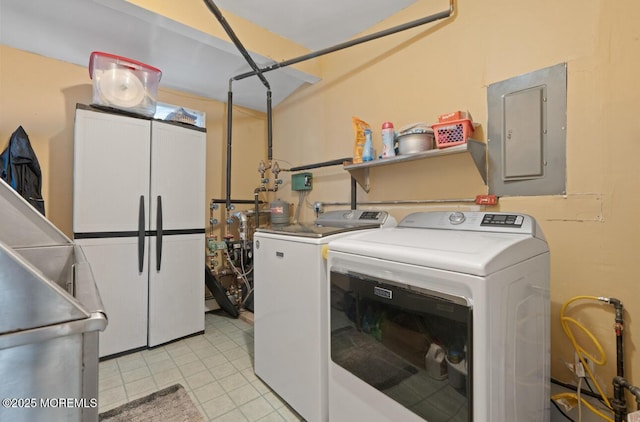517 Laurel Ave, West Allenhurst, NJ 07711 - laundry area featuring electric panel, washer and clothes dryer, and light tile patterned flooring
