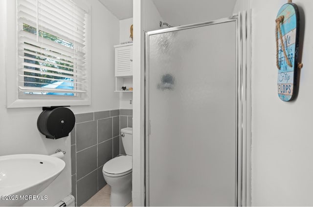 517 Laurel Ave, West Allenhurst, NJ 07711 - bathroom with a shower stall, tile walls, and tile patterned flooring