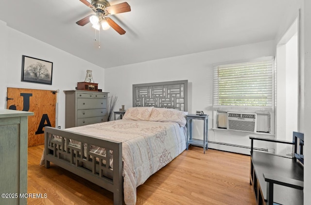 517 Laurel Ave, West Allenhurst, NJ 07711 - bedroom with wood finished floors, vaulted ceiling, a baseboard radiator, a ceiling fan, and cooling unit
