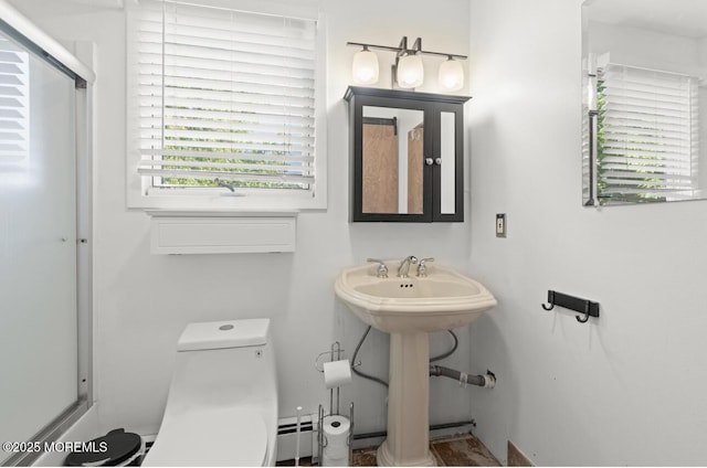 517 Laurel Ave, West Allenhurst, NJ 07711 - bathroom featuring plenty of natural light and a baseboard heating unit