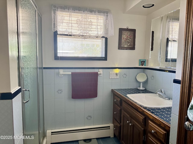1408 Anvil Way, Toms River, NJ 08755 - full bath featuring baseboard heating, vanity, a stall shower, tile walls, and a wainscoted wall