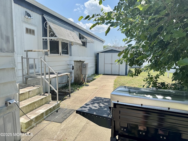 1408 Anvil Way, Toms River, NJ 08755 - rear view of property featuring a storage unit and a hot tub