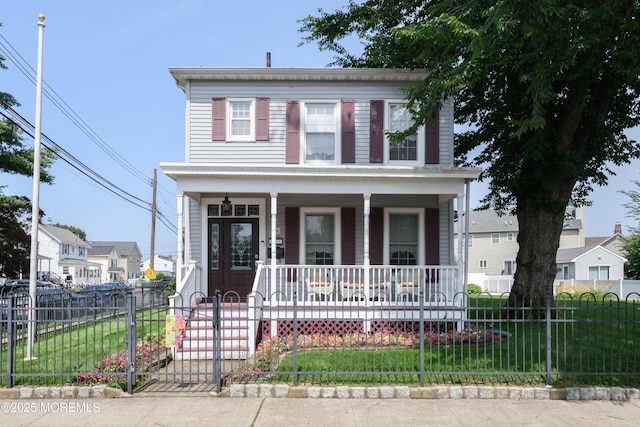 41 Cedar St, Keyport, NJ 07735 - view of front facade featuring a porch, a fenced front yard, and a gate
