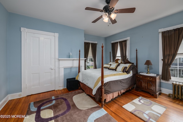 41 Cedar St, Keyport, NJ 07735 - bedroom featuring radiator, wood finished floors, and a ceiling fan