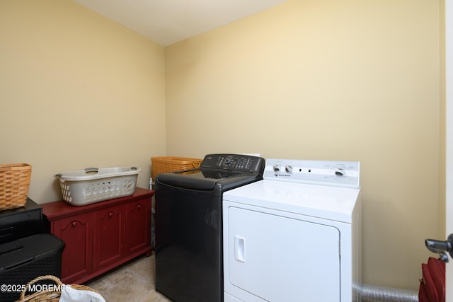 41 Cedar St, Keyport, NJ 07735 - laundry room with washing machine and clothes dryer, light tile patterned floors, and cabinet space