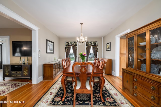 41 Cedar St, Keyport, NJ 07735 - dining space featuring light wood-style floors and a chandelier