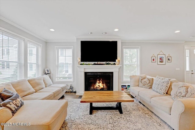 2 Lawley Dr, Lincroft, NJ 07738 - living room with plenty of natural light, a warm lit fireplace, crown molding, recessed lighting, and wood finished floors