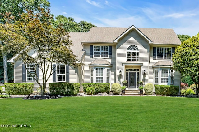 45 Erin Dr, Jackson, NJ 08527 - colonial home with a front yard and roof with shingles
