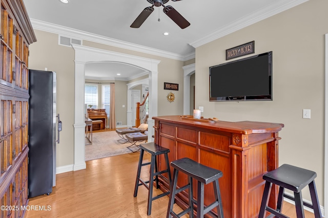 45 Erin Dr, Jackson, NJ 08527 - indoor dry bar with a ceiling fan, arched walkways, light wood-style floors, crown molding, and recessed lighting