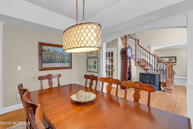 45 Erin Dr, Jackson, NJ 08527 - dining area featuring ornate columns, arched walkways, stairway, and wood finished floors