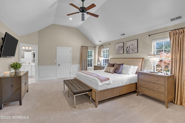 45 Erin Dr, Jackson, NJ 08527 - bedroom featuring light colored carpet, lofted ceiling, wainscoting, connected bathroom, and a decorative wall