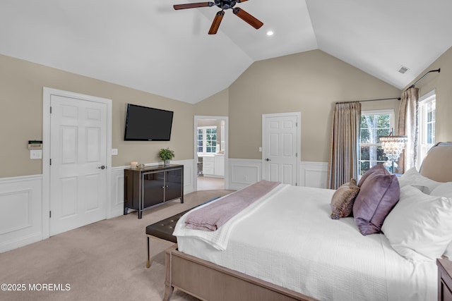45 Erin Dr, Jackson, NJ 08527 - bedroom with wainscoting, light colored carpet, vaulted ceiling, multiple windows, and a decorative wall