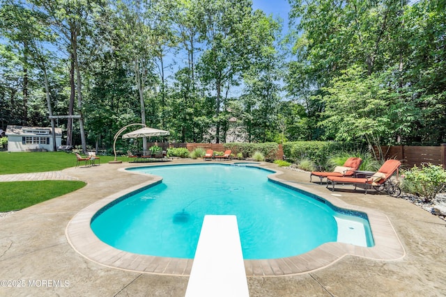 45 Erin Dr, Jackson, NJ 08527 - view of swimming pool featuring a patio area, a fenced backyard, a diving board, and view of wooded area