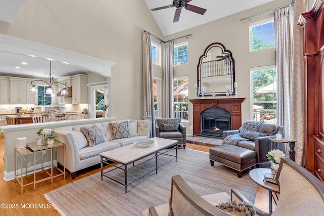 45 Erin Dr, Jackson, NJ 08527 - living area with high vaulted ceiling, light wood-type flooring, a ceiling fan, a glass covered fireplace, and recessed lighting