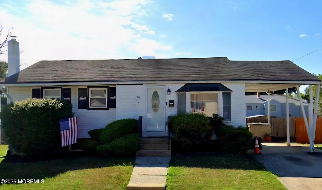 311 Harrison Ave, Union Beach, NJ 07735 - view of front of house with a chimney and roof with shingles