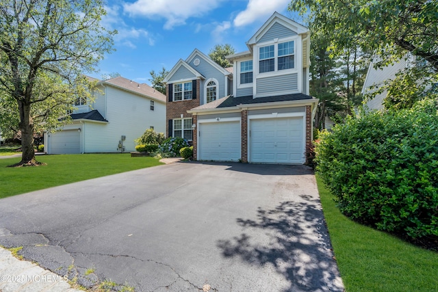4 Queens Pass, Colts Neck, NJ 07722 - traditional-style house featuring brick siding, asphalt driveway, a front lawn, and an attached garage