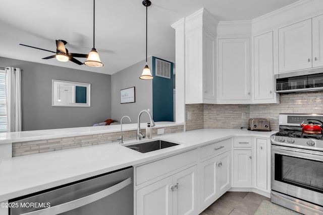 4 Queens Pass, Colts Neck, NJ 07722 - kitchen with appliances with stainless steel finishes, backsplash, ceiling fan, and white cabinetry