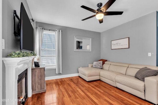 4 Queens Pass, Colts Neck, NJ 07722 - living room featuring ceiling fan, light wood finished floors, and a fireplace