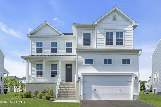 3 Devon Dr, Howell, NJ 07731 - view of front of house featuring an attached garage, a porch, a standing seam roof, a metal roof, and driveway