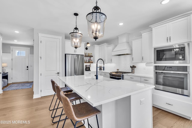 3 Devon Dr, Howell, NJ 07731 - kitchen featuring appliances with stainless steel finishes, custom exhaust hood, recessed lighting, decorative backsplash, and white cabinetry