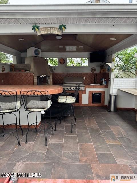 33 Tennent Ave, Englishtown, NJ 07726 - view of patio featuring exterior kitchen, a gazebo, and outdoor dining space