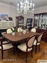 33 Tennent Ave, Englishtown, NJ 07726 - dining room with a chandelier, crown molding, wood finished floors, and a fireplace