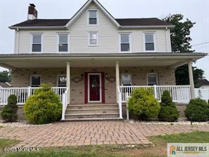 33 Tennent Ave, Englishtown, NJ 07726 - farmhouse inspired home featuring a chimney and a porch