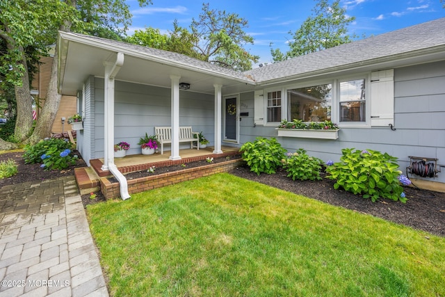 2120 Frances Dr, Point Pleasant, NJ 08742 - entrance to property featuring covered porch, a yard, and a shingled roof