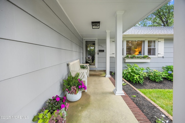 2120 Frances Dr, Point Pleasant, NJ 08742 - property entrance with covered porch and roof with shingles
