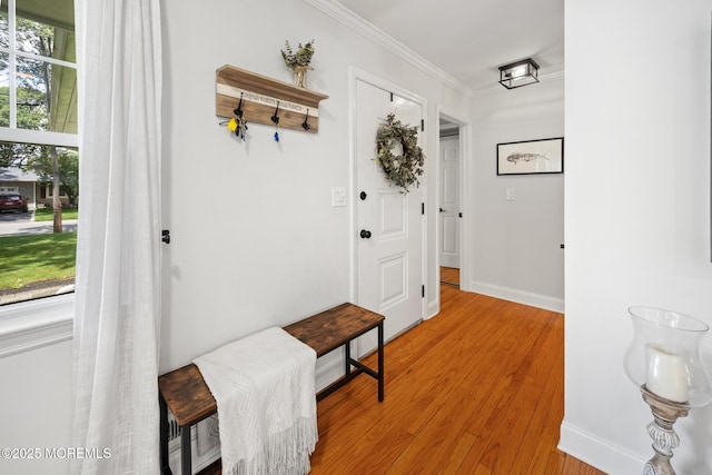 2120 Frances Dr, Point Pleasant, NJ 08742 - doorway to outside featuring light wood finished floors and ornamental molding