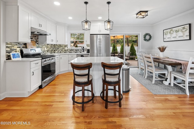 2120 Frances Dr, Point Pleasant, NJ 08742 - kitchen featuring stainless steel appliances, crown molding, healthy amount of natural light, light countertops, and recessed lighting