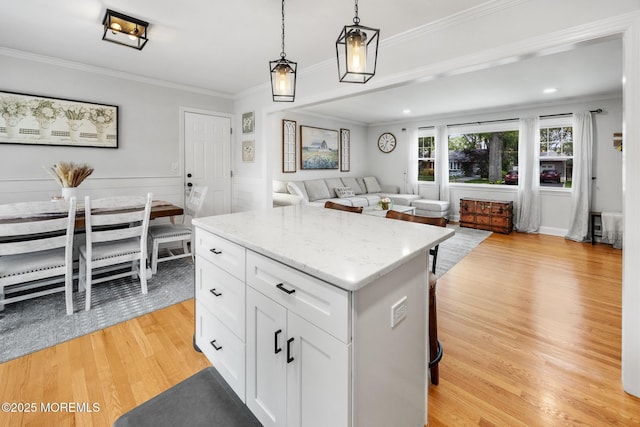 2120 Frances Dr, Point Pleasant, NJ 08742 - kitchen featuring light wood-style flooring, white cabinets, pendant lighting, a center island, and open floor plan