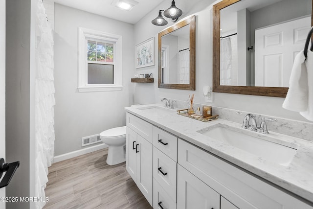 2120 Frances Dr, Point Pleasant, NJ 08742 - full bath featuring double vanity and wood finished floors