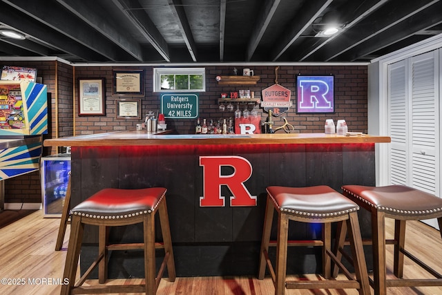 2120 Frances Dr, Point Pleasant, NJ 08742 - indoor dry bar with brick wall, wood finished floors, and wine cooler