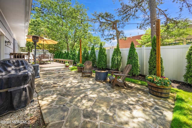 2120 Frances Dr, Point Pleasant, NJ 08742 - fenced backyard with outdoor dining area, a patio area, and a wooden deck
